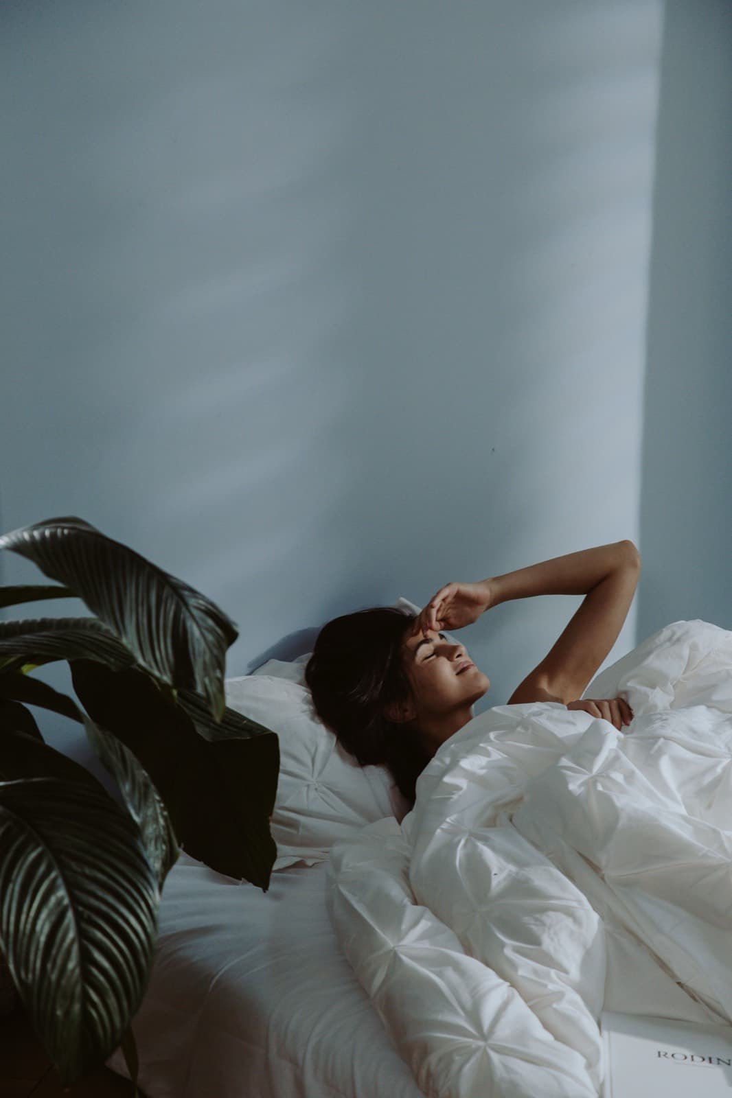 A woman waking gently in soft morning light